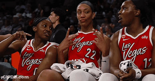 Three Female Basketball Players Wearing Red Jerseys With Las Vegas Written On Them GIF