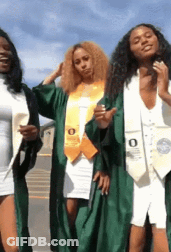 Three Female Graduates Are Posing For A Picture And One Has The Letter O On Her Sash . GIF