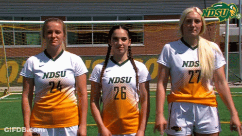 Three Female Soccer Players For Ndsu Are Standing Next To Each Other GIF