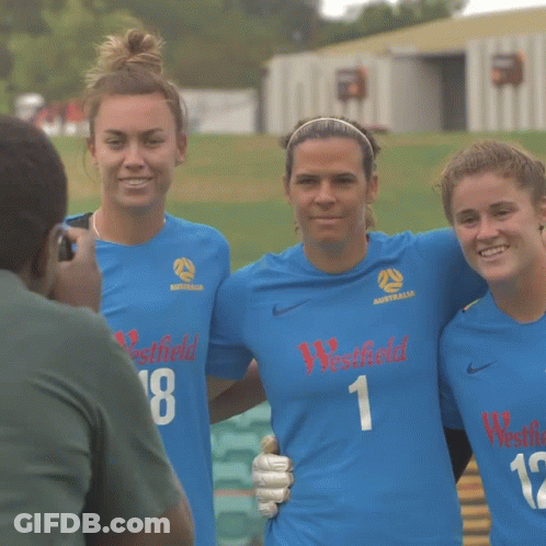 Three Female Soccer Players Wearing Blue Westfield Jerseys Pose For A Photo GIF
