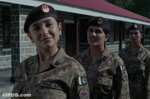 Three Female Soldiers In Front Of Building GIF