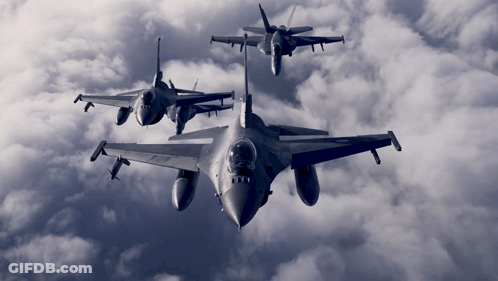 Three Fighter Jets Flying In Cloudy Sky GIF