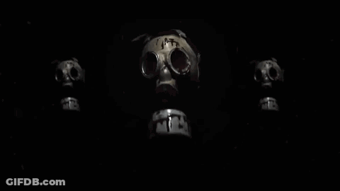 Three Gas Masks Are Sitting Next To Each Other On A Black Background . GIF