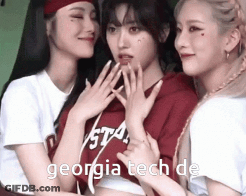 Three Girls Are Posing For A Picture And One Has Georgia Tech On Her Shirt GIF