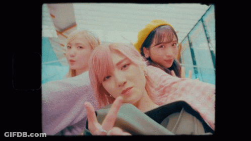 Three Girls Are Posing For A Picture And One Is Wearing A Yellow Hat GIF