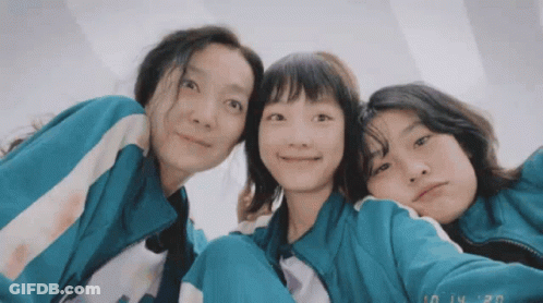 Three Girls Are Posing For A Picture With The Date 10 14 20 On The Bottom Right GIF