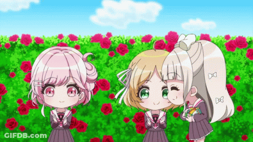 Three Girls Are Standing In Front Of A Field Of Roses GIF