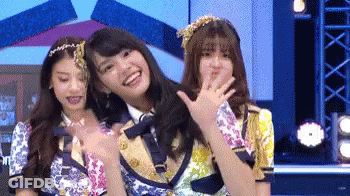 Three Girls Standing On Stage GIF