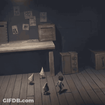 Three Gnomes Standing On Wooden Floor In Dark Room GIF