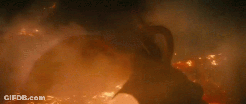 Three-Headed Dragon Flying Through Foggy Forest GIF