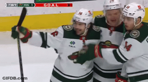 Three Hockey Players Are Celebrating A Goal With The Tsn Logo In The Background GIF