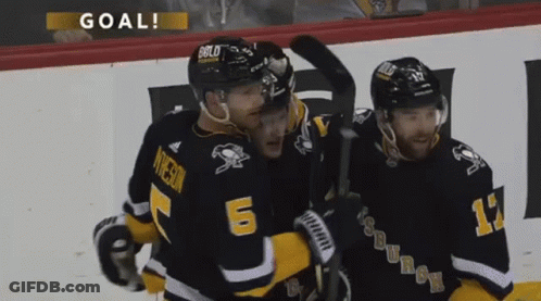 Three Hockey Players Celebrating Goal With Number 6 GIF