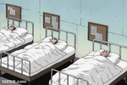 Three Hospital Beds Lined Up With Bulletin Boards GIF