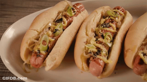 Three Hot Dogs With Onions And Mustard GIF