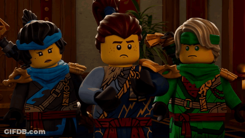 Three Lego Figures Are Standing Next To Each Other With One Wearing A Blue Scarf That Says Ninja GIF