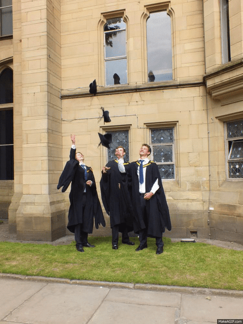 Three Man Throwing Graduation Hats GIF