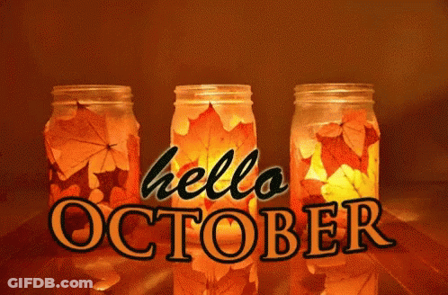 Three Mason Jars With Leaves Inside And The Words Hello October GIF
