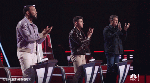 Three Men Applaud In Front Of A Screen That Says Nbc GIF