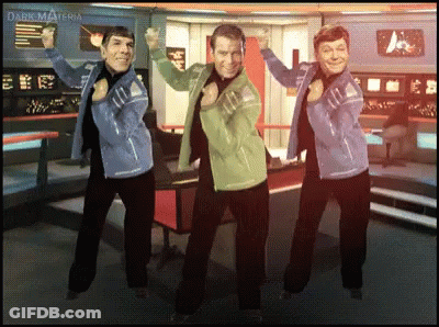 Three Men Are Dancing In Front Of A Wall That Says Dark Materia On It GIF