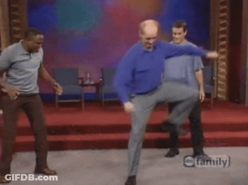 Three Men Are Dancing On A Stage In Front Of A Family Logo GIF