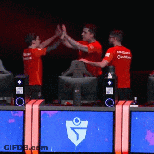Three Men Are Giving Each Other A High Five While Wearing Red Mindduke Shirts GIF
