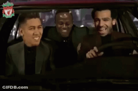 Three Men Are Laughing In A Car With The Liverpool Logo On The Bottom Right GIF