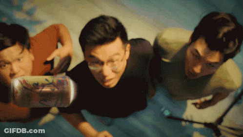Three Men Are Looking Up At A Can That Says ' A ' On It GIF