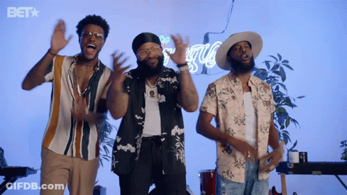 Three Men Are Singing In Front Of A Bet Sign GIF