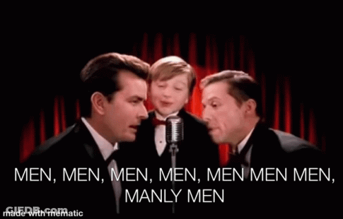 Three Men Are Singing Into Microphones In Front Of A Red Curtain With The Words Men Men Men Men Men Manly Men Written On GIF