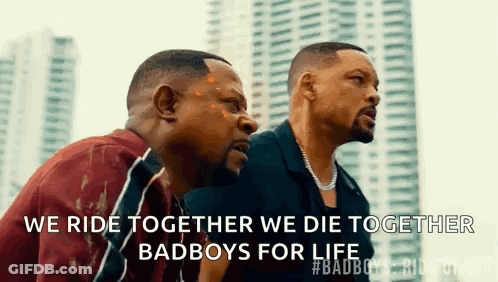 Three Men Are Sitting Next To Each Other In Front Of A City Skyline . GIF