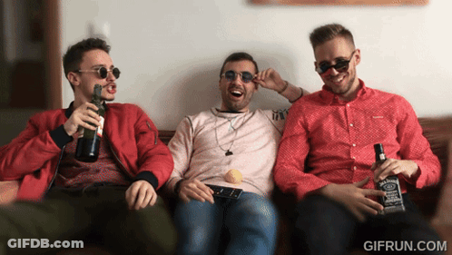 Three Men Are Sitting On A Couch Holding Bottles Of Jack Daniels Whiskey GIF