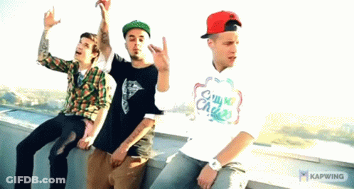 Three Men Are Sitting On A Ledge With One Wearing A Shirt That Says Chill My Chase GIF
