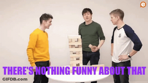 Three Men Are Standing Around A Table With A Stack Of Wooden Blocks On Top Of It . GIF