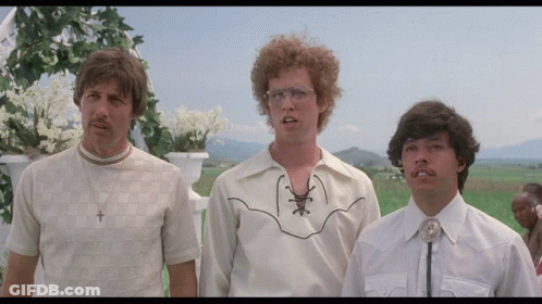 Three Men Are Standing In A Field And One Of Them Is Wearing A Cowboy Shirt GIF