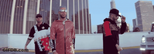 Three Men Are Standing In Front Of A Building And One Of Them Is Wearing A Jacket That Says Supreme GIF