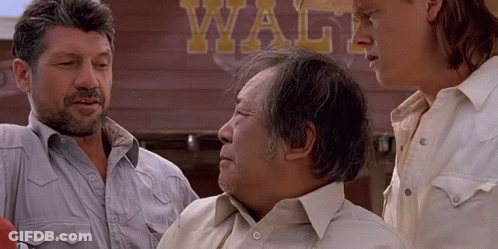 Three Men Are Standing In Front Of A Sign That Says Waltz GIF