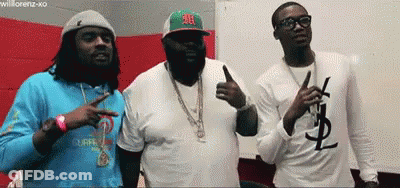 Three Men Are Standing Next To Each Other And One Of Them Has A Ysl T-Shirt On GIF