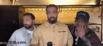 Three Men Are Standing Next To Each Other In A Room . GIF