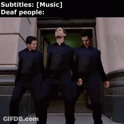 Three Men Are Standing Next To Each Other In Front Of A Building And Dancing . GIF