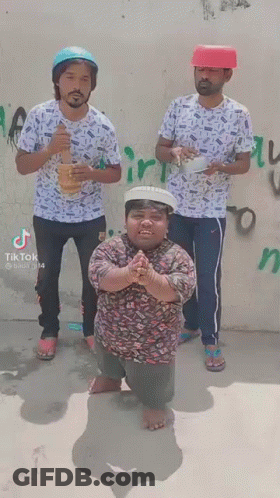 Three Men Are Standing Next To Each Other In Front Of A Wall . One Of The Men Is Wearing A Red Hat . GIF
