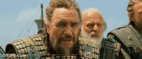 Three Men Are Standing Next To Each Other On A Boat . GIF