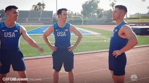 Three Men Are Standing On A Track Wearing Usa Shirts GIF