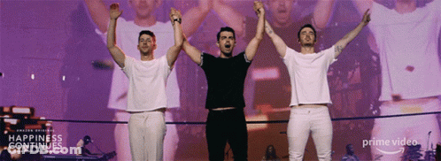 Three Men Arms Up Stage Happiness Continues GIF