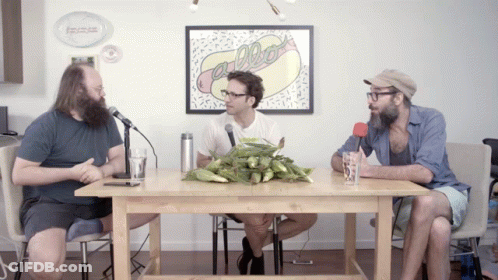 Three Men At Table With Hot Dog Picture GIF