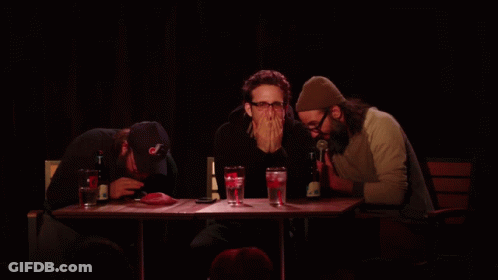 Three Men At Table With Yellow Unscoop Text GIF