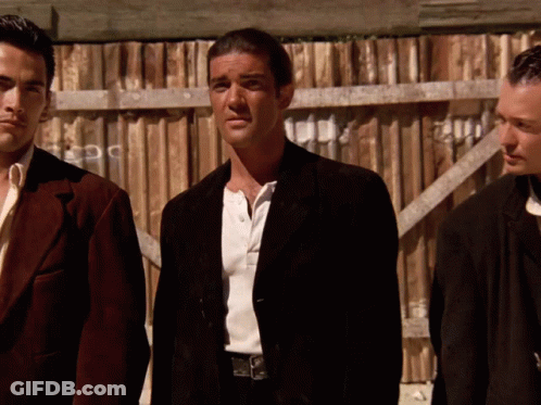 Three Men At Wooden Fence One In Black Jacket GIF