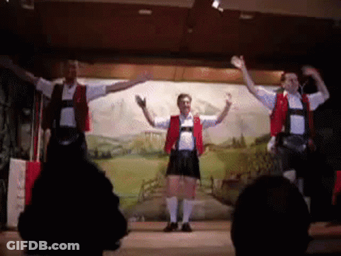 Three Men Dancing On Stage GIF