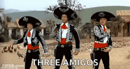 Three Men Dressed As Mariachis Are Dancing In A Desert . GIF