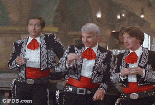 Three Men Dressed As Mariachis Drinking GIF