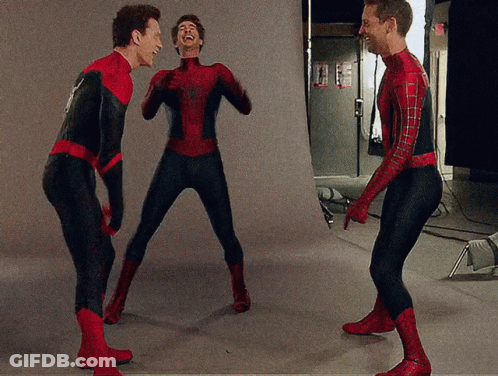 Three Men Dressed In Spiderman Costumes Are Laughing Together GIF